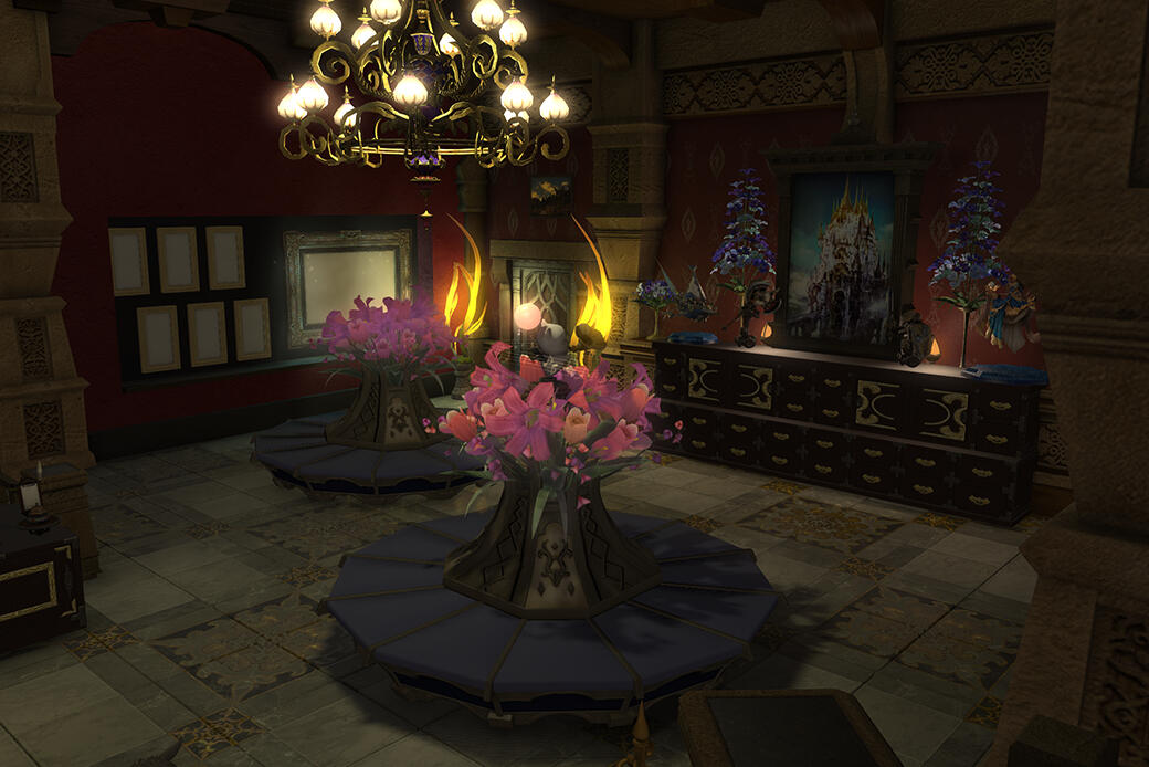 There is a room with brown stone trim and red walls, with two blue circle seats that have flowerpots in the middle.